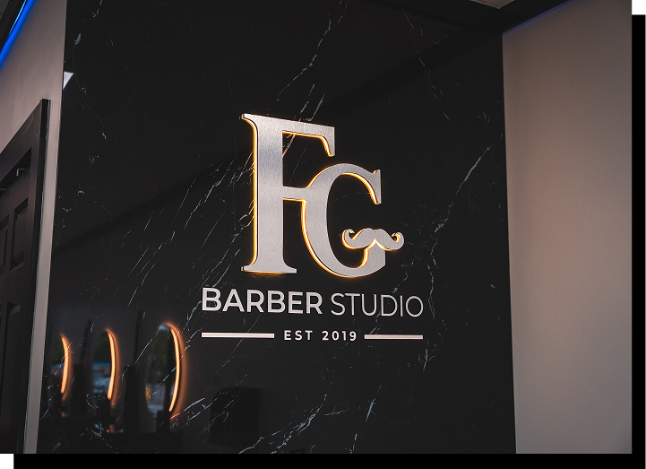 FG Barber Studio logo sign inside the shop